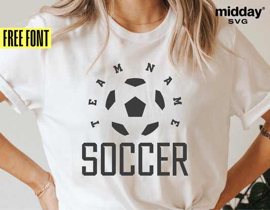 Woman wearing a white t-shirt with customizable soccer team design in black, featuring "Team Name Soccer" text and soccer ball graphic.