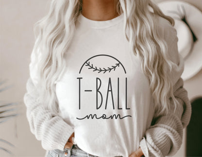 Woman wearing a white T-Ball Mom shirt with a baseball graphic, perfect for T-ball enthusiasts, compatible with Cricut and Silhouette.