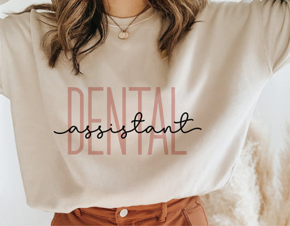 Woman wearing a shirt with 'Dental Assistant' text, showcasing Cricut cut file design.