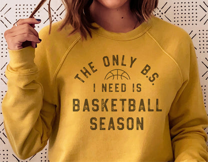 Yellow sweatshirt with text 'The Only B.S. I Need is Basketball Season' featuring basketball design, ideal for basketball enthusiasts.