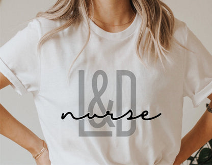 Woman wearing a white shirt with 'L&D Nurse' design, perfect for Cricut and vinyl cutting projects.