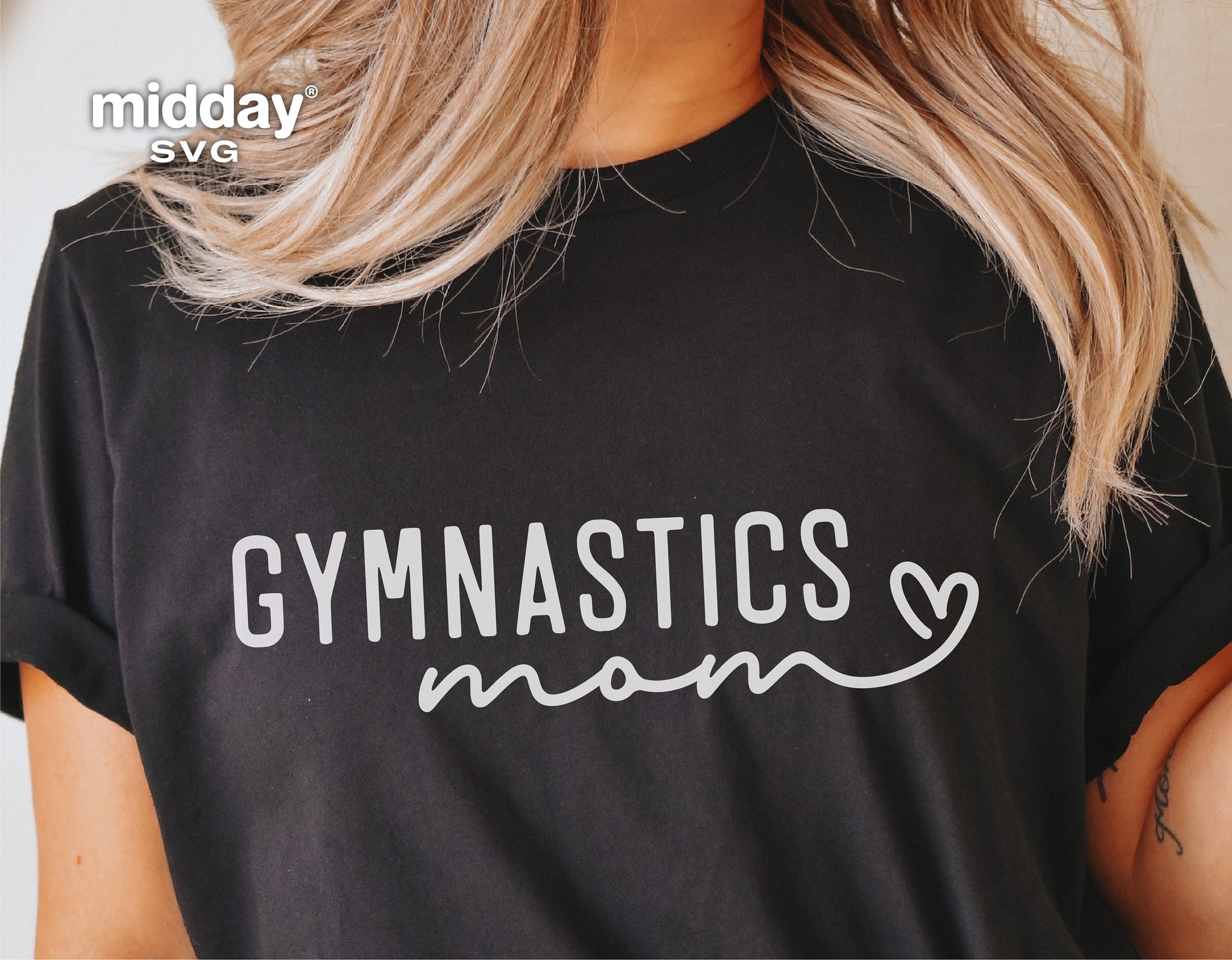 Black t-shirt with 'Gymnastics Mom' design in white, featuring a heart, ideal for Cricut and Silhouette projects.