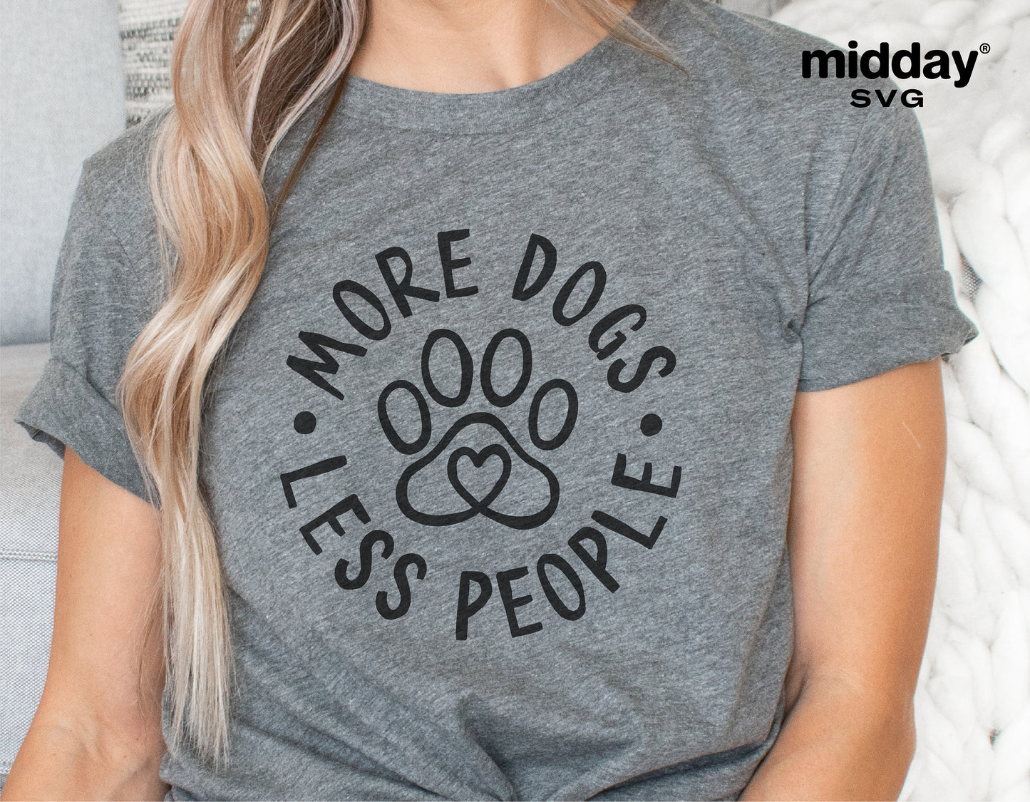 Gray t-shirt with 'More Dogs Less People' paw print design, perfect for dog lovers. Ideal for Cricut and Silhouette projects.