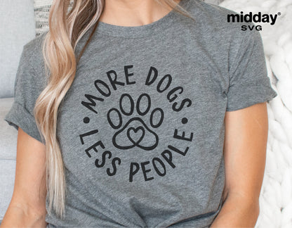 Gray t-shirt with 'More Dogs Less People' paw print design, perfect for dog lovers. Ideal for Cricut and Silhouette projects.