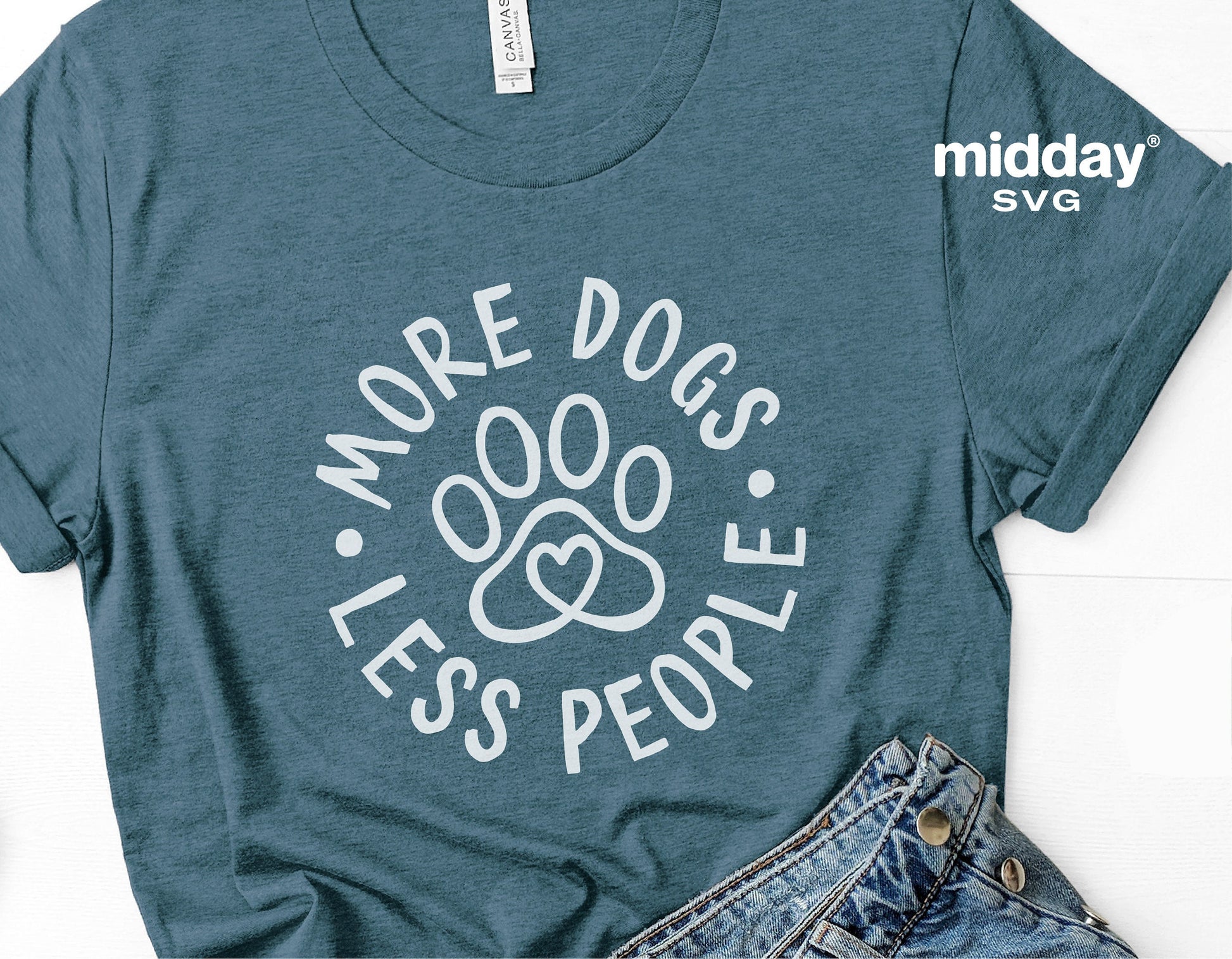 Blue t-shirt with 'More Dogs Less People' design and paw print, perfect for dog lovers. SVG file for Cricut and Silhouette crafts.