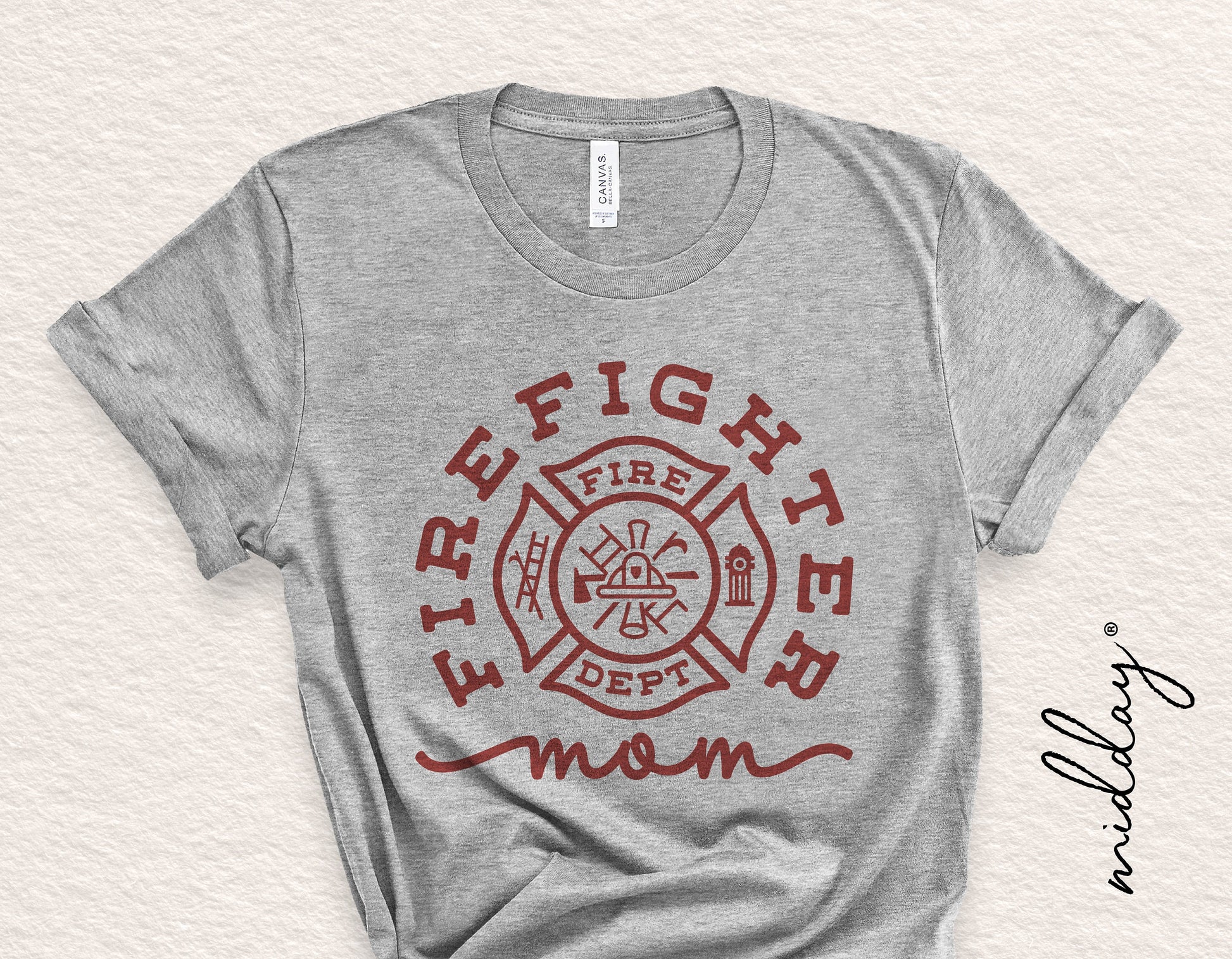 Gray t-shirt featuring 'Firefighter Mom' design with a firefighter badge, perfect for gifts or personal use, ideal for Cricut and Silhouette.