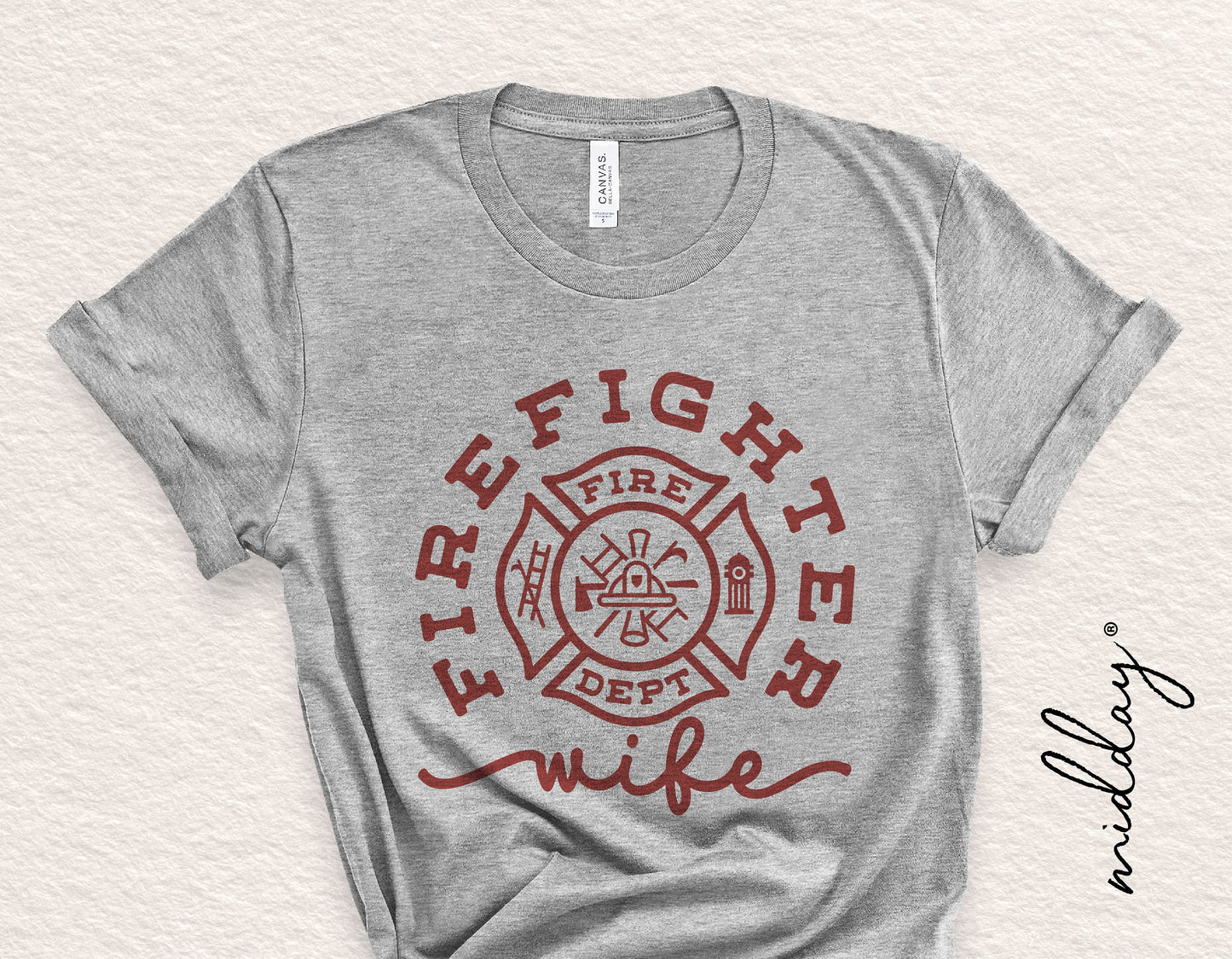 Gray t-shirt with 'Firefighter Wife' design featuring a firefighter badge, ideal for Cricut and Silhouette projects.