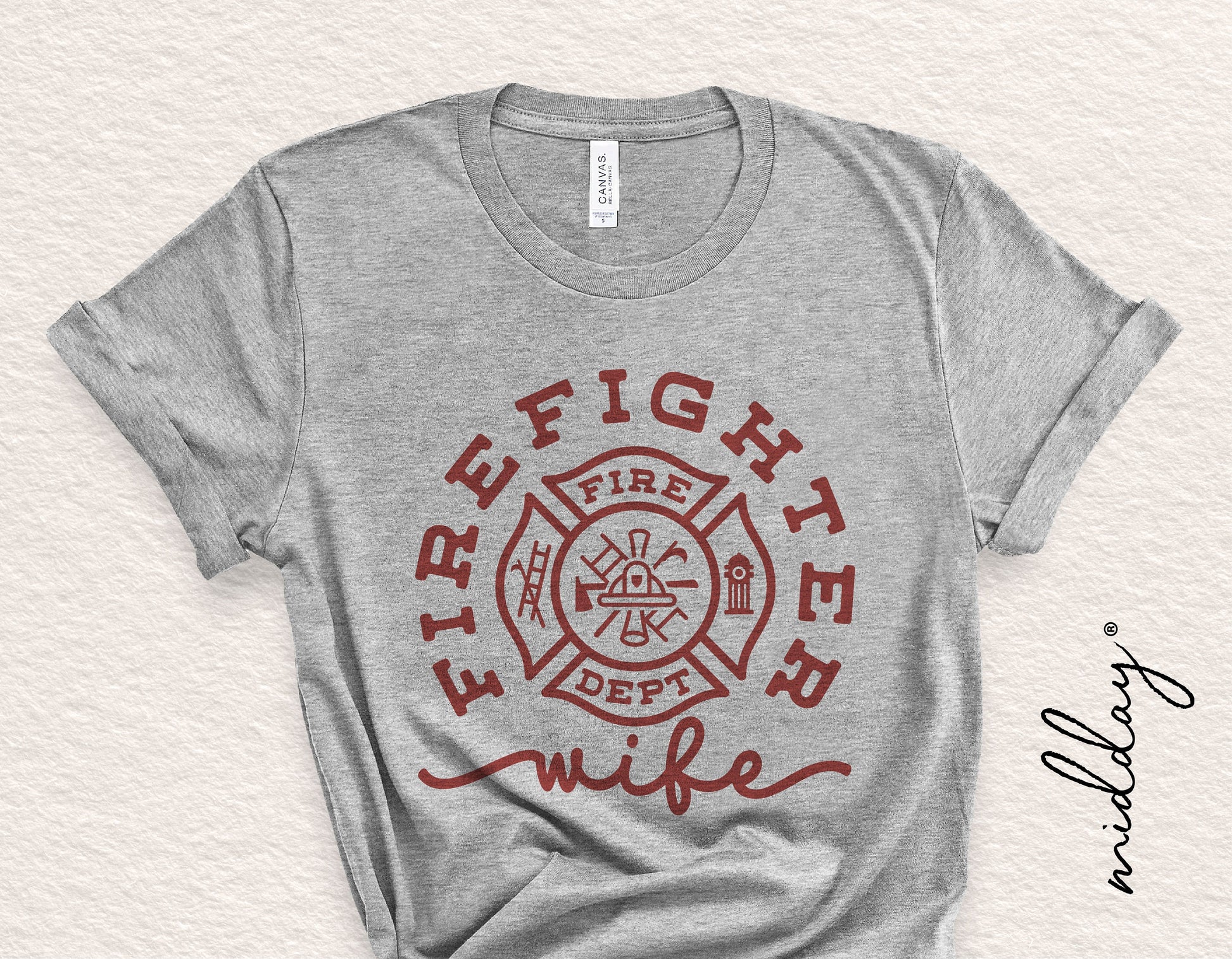 Gray t-shirt with 'Firefighter Wife' design featuring a firefighter badge, ideal for Cricut and Silhouette projects.