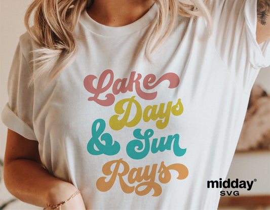 Woman wearing a white t-shirt with "Lake Days & Sun Rays" colorful print, perfect for lake house decor and camping.