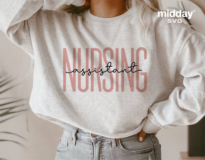 Woman wearing gray sweatshirt with 'Nursing Assistant' graphic, suitable for Cricut and Silhouette crafting, sublimation design.