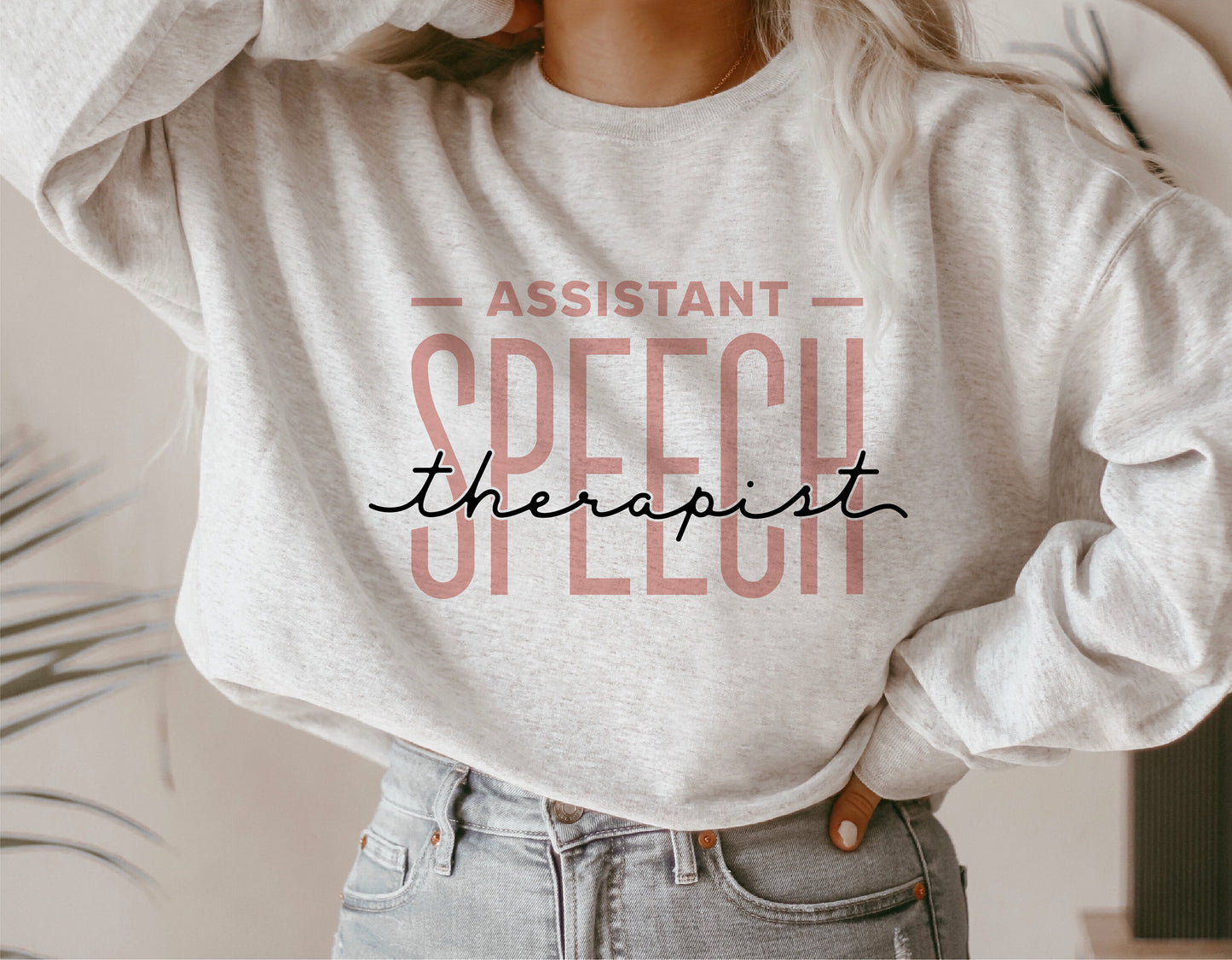 Woman wearing sweater with 'Assistant Speech Therapist' design, ideal for speech-language pathologists, Cricut cut files, sublimation.