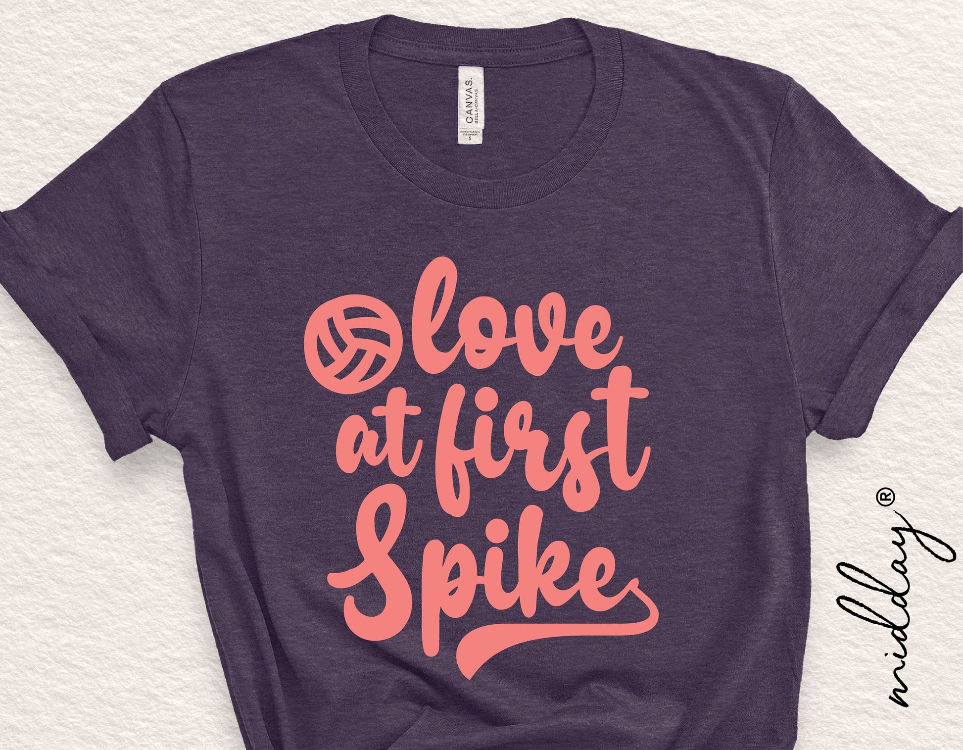 “Love At First Spike” volleyball graphic on a dark shirt, perfect for volleyball enthusiasts, coaches, or moms. Ideal for Cricut projects.