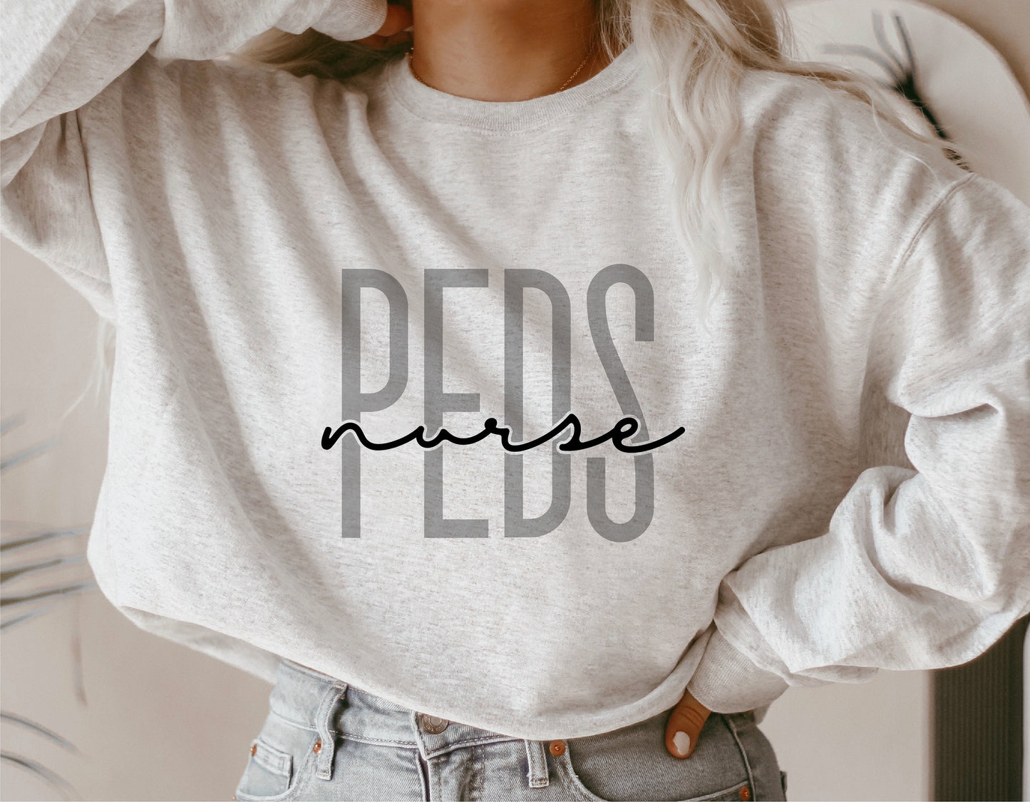 Gray sweatshirt with 'PEDS Nurse' text in bold font, designed for pediatric nurses, suitable for Cricut and Silhouette cutting machines.