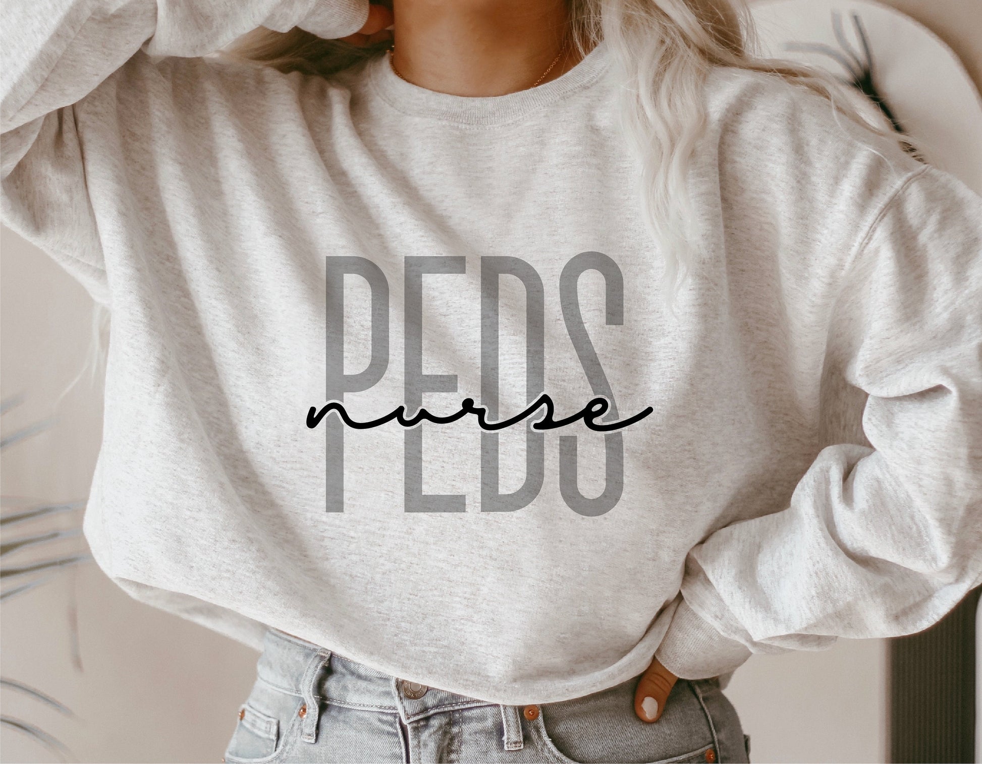 Gray sweatshirt with 'PEDS Nurse' text in bold font, designed for pediatric nurses, suitable for Cricut and Silhouette cutting machines.