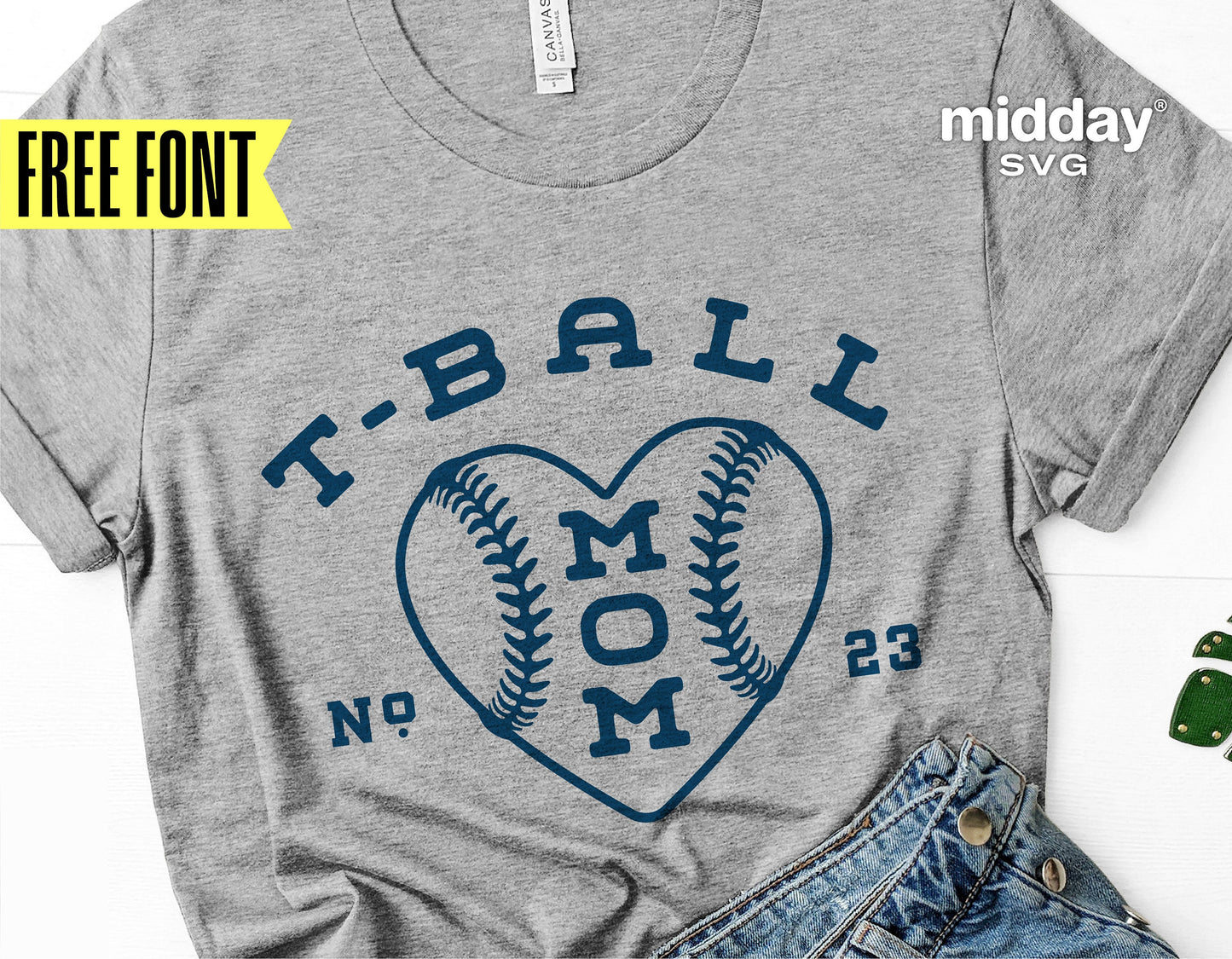 Gray t-shirt with 'T-Ball Mom' heart baseball design, surrounded by jeans. SVG cut file for Cricut and Silhouette crafts. Free font included.
