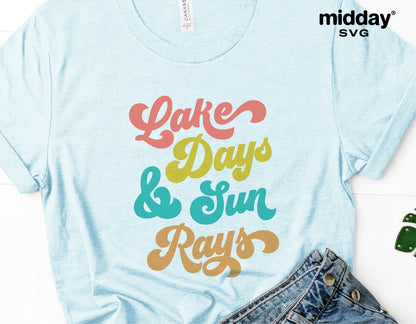 Light blue t-shirt featuring 'Lake Days & Sun Rays' colorful text design, perfect for lake house decor and camping enthusiasts.