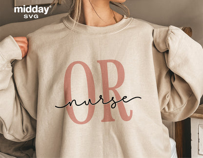 Woman wearing beige sweatshirt with 'OR nurse' design in pink and black letters, perfect for operating room nurse apparel or gifts.