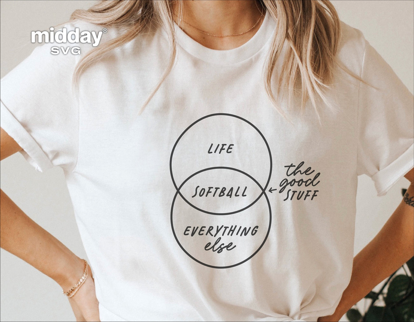 Woman wearing a funny softball shirt with a Venn diagram design labeled 'Life,' 'Softball,' and 'The Good Stuff' in a casual style.