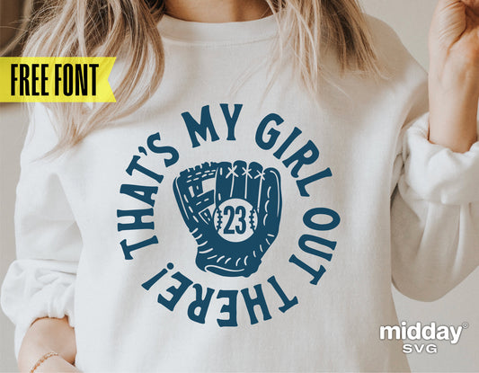 Woman wearing sweatshirt with 'That's My Girl Out There' softball design.