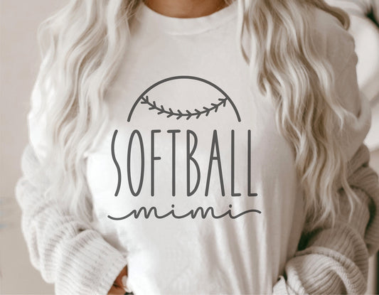 Woman wearing white shirt with 'Softball Mimi' design, ideal for Cricut and Silhouette projects, including tumblers and sweatshirts.