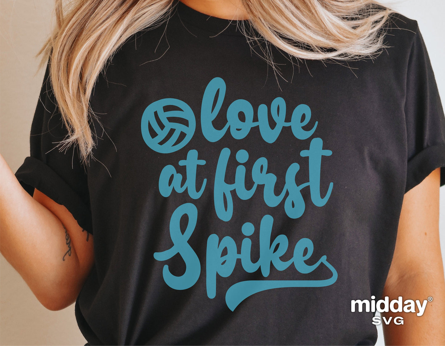 Black shirt with blue 'Love At First Spike' volleyball design, featuring stylish lettering and volleyball graphic, perfect for sports fans.