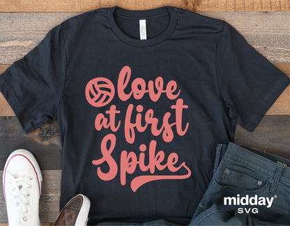 Black t-shirt with 'Love At First Spike' volleyball design in pink, perfect for volleyball moms and coaches. Includes sneakers and jeans.