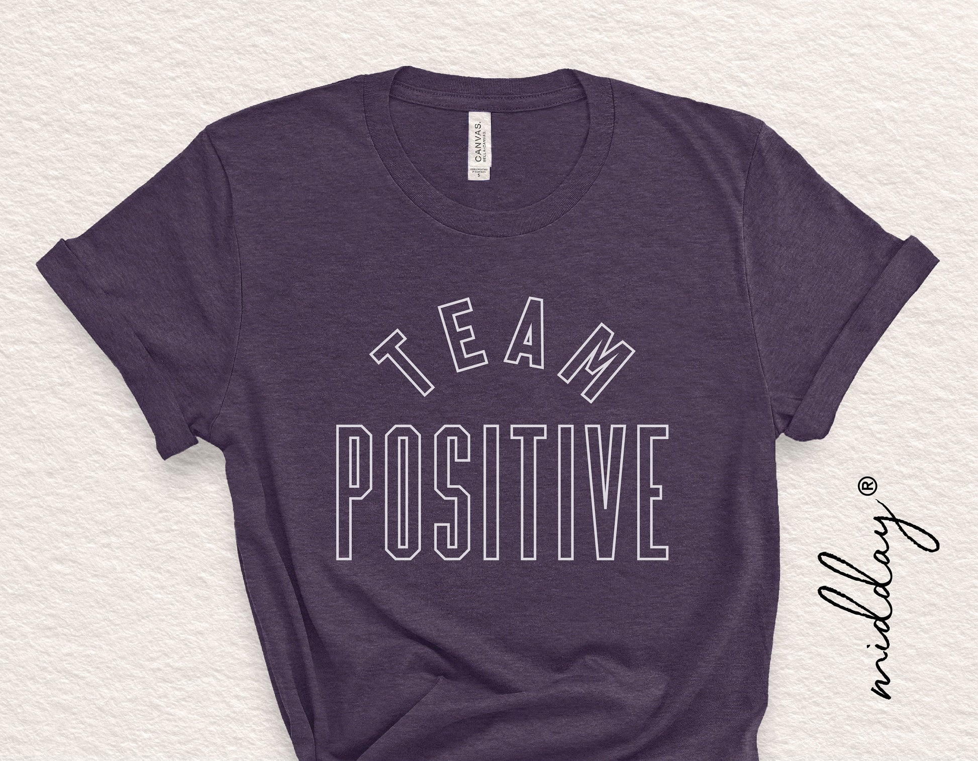 Dark t-shirt with 'Team Positive' text for inspirational and motivational purposes, suitable for Cricut and Silhouette design projects.