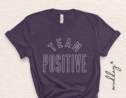Dark t-shirt with 'Team Positive' text for inspirational and motivational purposes, suitable for Cricut and Silhouette design projects.