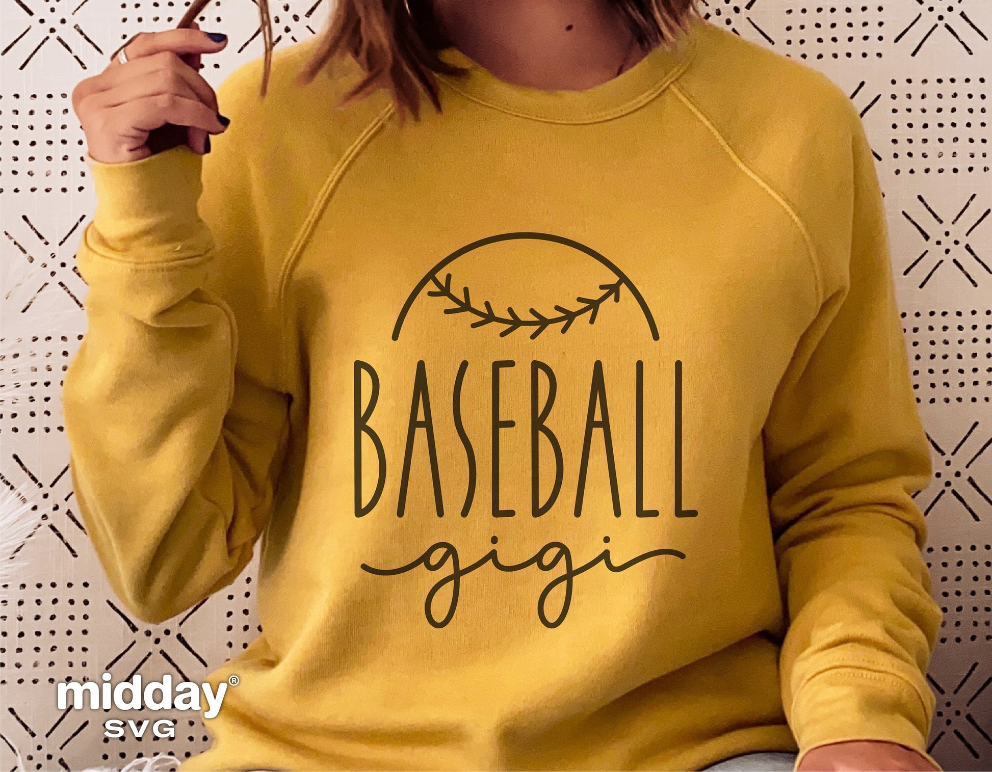 Woman wearing yellow sweatshirt with 'Baseball Gigi' design, suitable for Cricut and Silhouette projects