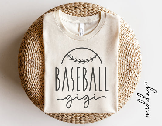 Baseball Gigi shirt with baseball design, perfect for grandmas who love baseball, displayed on a woven mat.