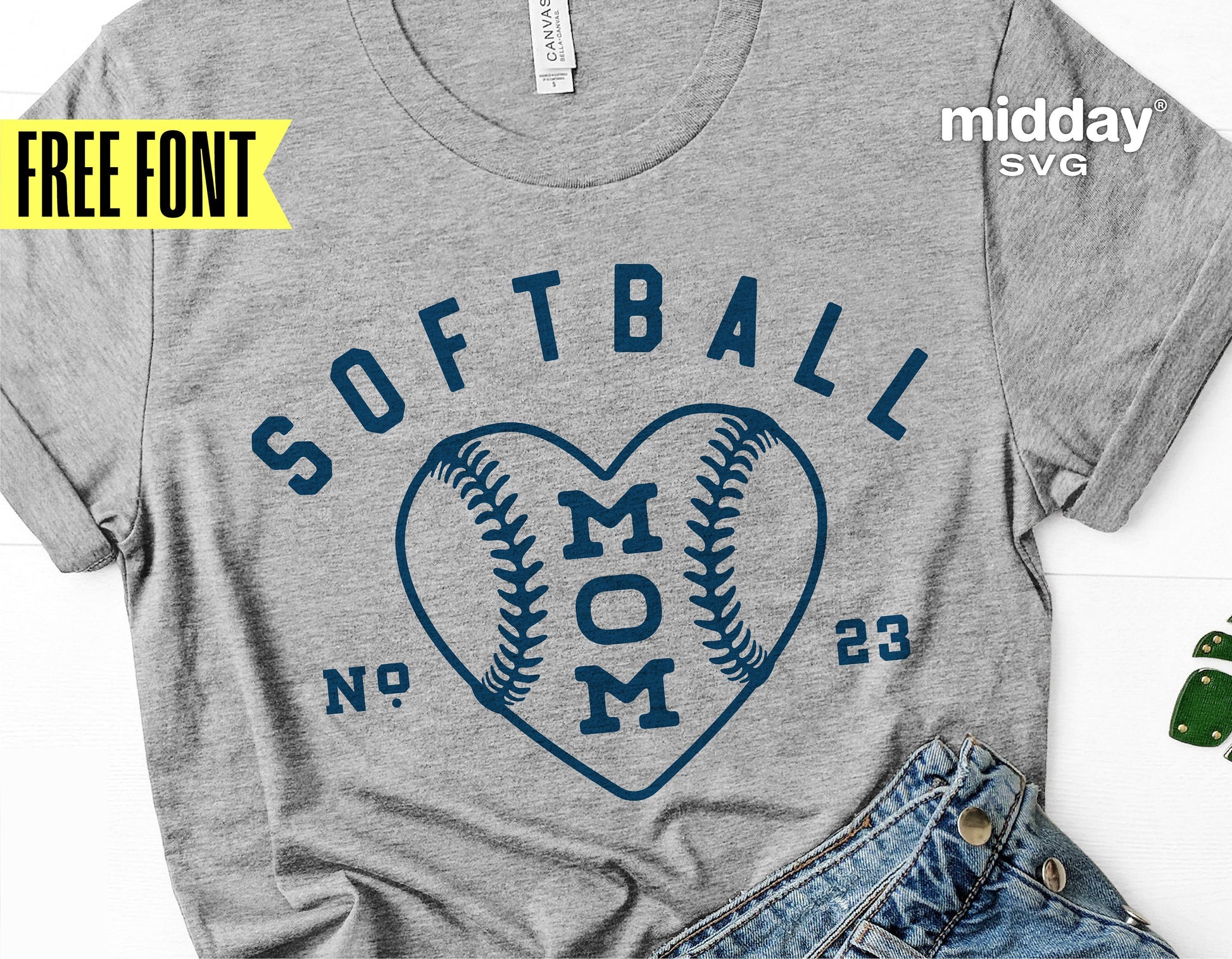 Gray t-shirt with 'Softball Mom' text and heart-shaped baseball design for Cricut, featuring free font by Midday SVG.