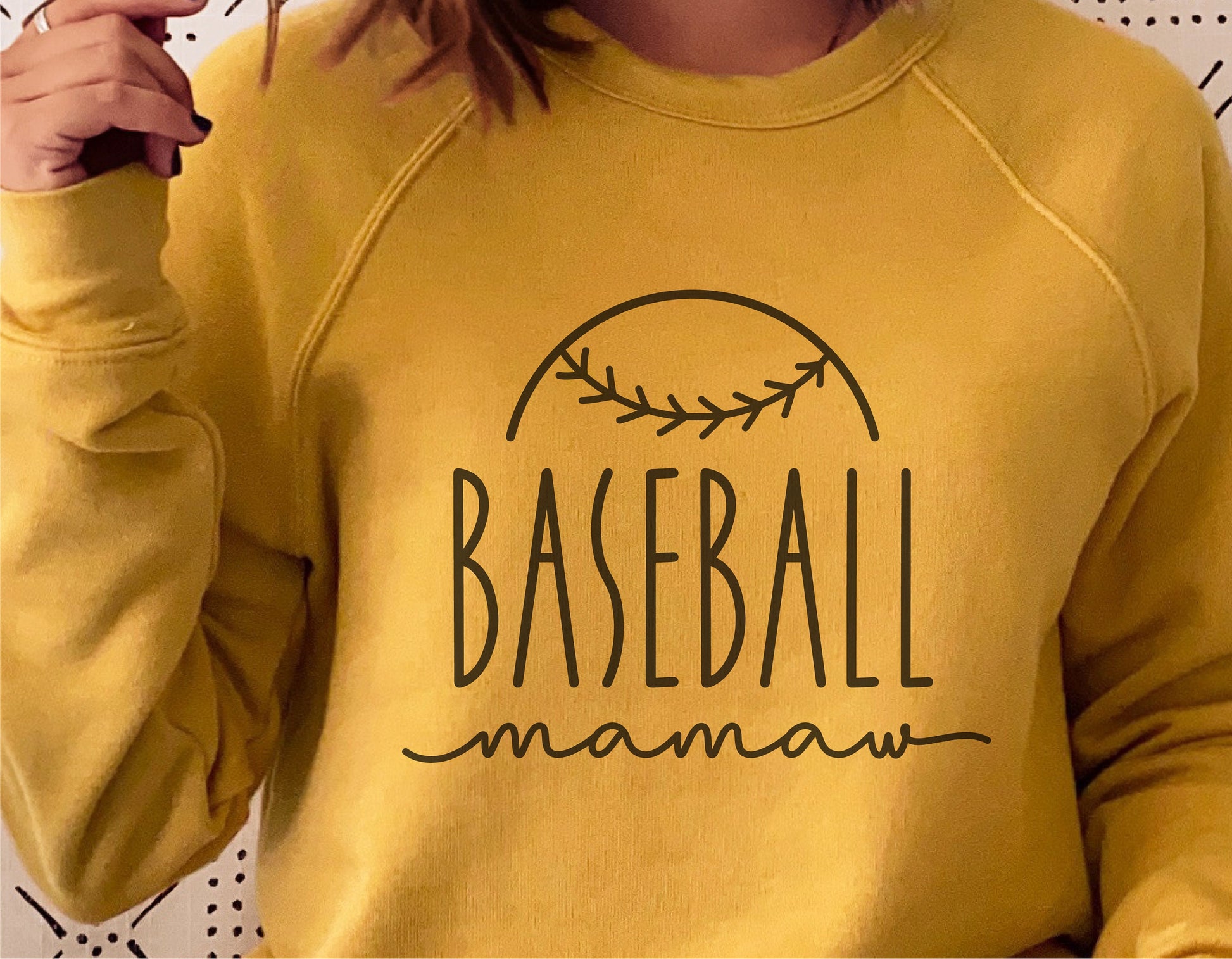 Yellow sweatshirt with 'Baseball Mamaw' design, featuring a baseball graphic, perfect for Cricut cut files and sublimation projects.