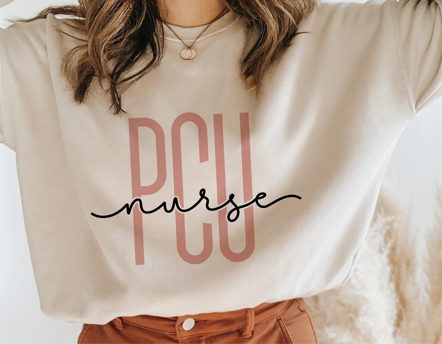 Beige shirt with 'PCU Nurse' design, ideal for Progressive Care Unit nursing enthusiasts, featuring stylish typography.