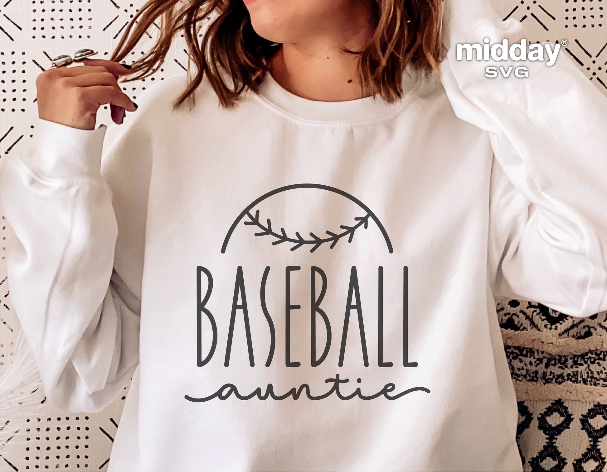 "Baseball Auntie" design on a white sweatshirt, ideal for Cricut and Silhouette cut files, perfect for baseball fans.