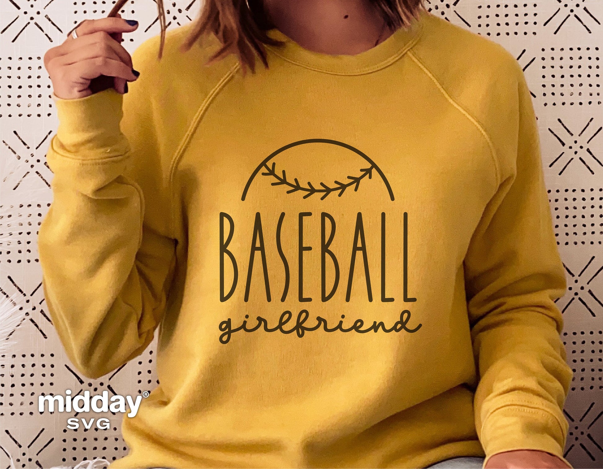 Woman wearing yellow sweatshirt with 'Baseball Girlfriend' design, perfect for Cricut and Silhouette crafting projects.