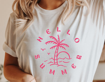 Woman wearing a white T-shirt with pink 'Hello Summer' design featuring a palm tree and sun, perfect for vacation and casual wear.