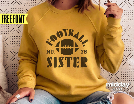 Woman wearing a mustard yellow sweatshirt with 'Football Sister No. 75' design, holding a football, promoting a free font offer.
