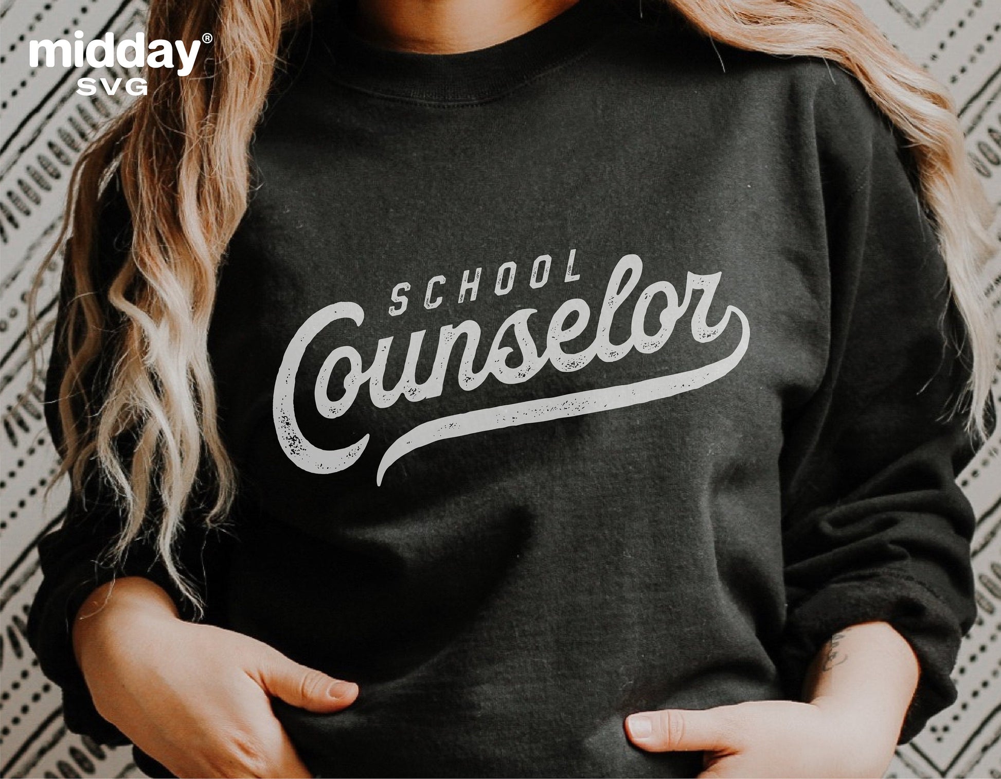 Woman wearing a black sweatshirt with 'School Counselor' text design, ideal for sublimation and cutting machines like Cricut.