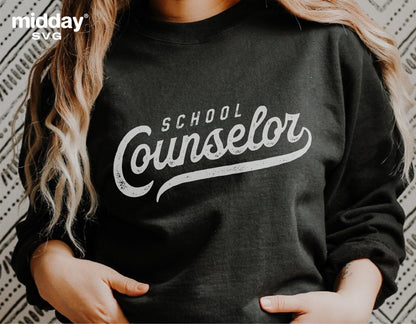 Woman wearing a black sweatshirt with 'School Counselor' text design, ideal for sublimation and cutting machines like Cricut.