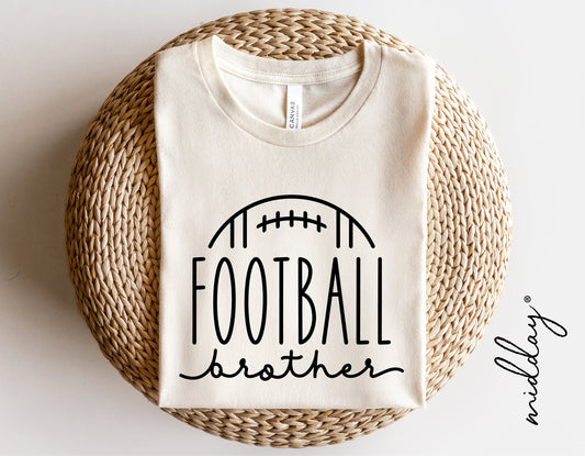 Cream t-shirt with 'Football Brother' design, suitable for Cricut and Silhouette projects, displayed on a wicker surface.