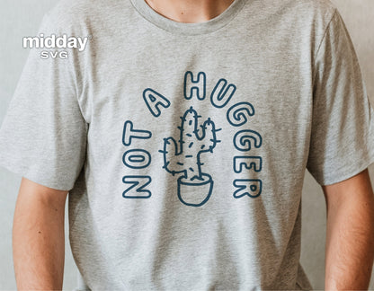 Gray t-shirt with 'Not a Hugger' funny cactus SVG design for gardening, Cricut, Silhouette crafts.