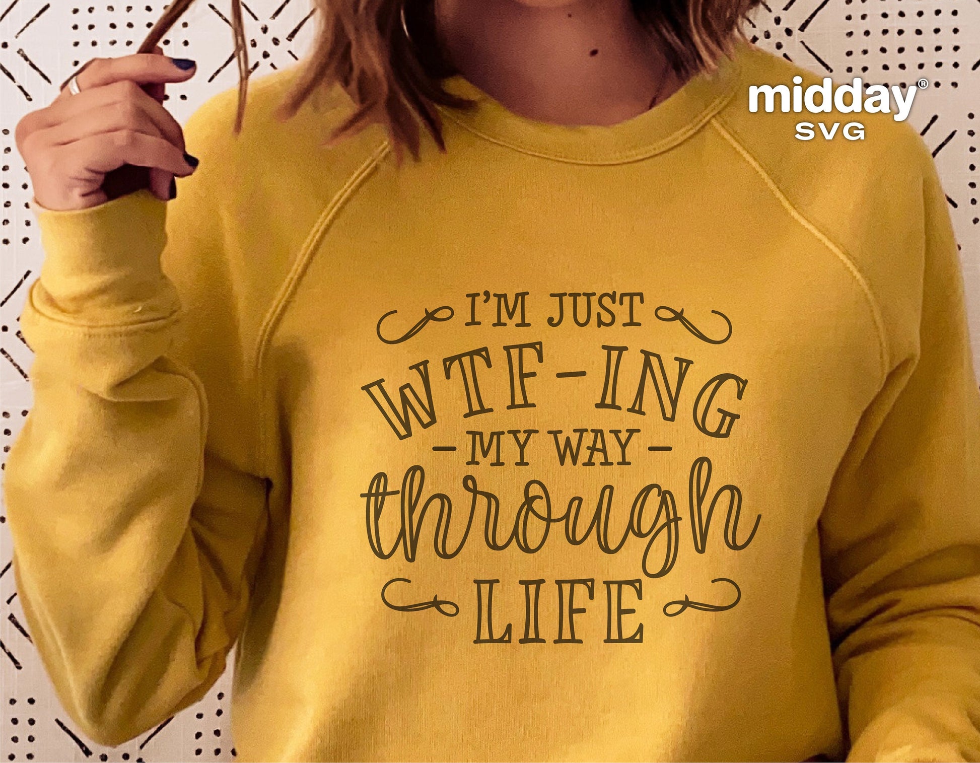 Yellow sweatshirt with sarcastic quote 'WTFing My Way Through Life' in stylish font, ideal for Cricut and Silhouette crafts.