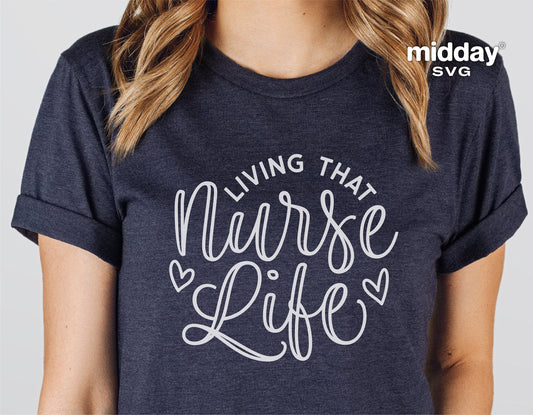 Woman wearing 'Living That Nurse Life' t-shirt in dark grey, showcasing nurse-themed design with heart accents.