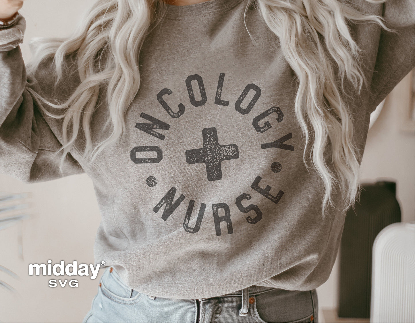 Gray sweatshirt with "Oncology Nurse" design featuring a cross, modeled casually, ideal for healthcare professionals.