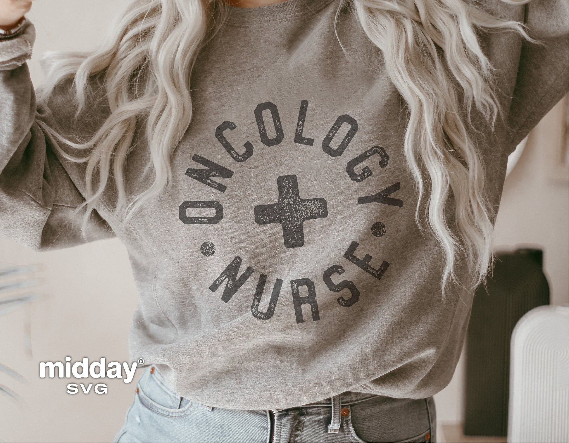 Gray sweatshirt with "Oncology Nurse" design featuring a cross, modeled casually, ideal for healthcare professionals.