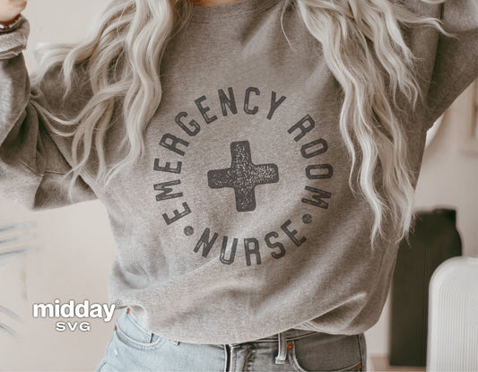 Woman wearing gray sweatshirt with 'Emergency Room Nurse' design featuring a medical cross, ideal for ER nurses and Cricut projects.
