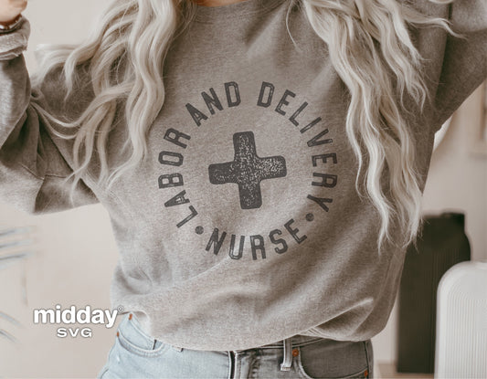 Gray sweatshirt featuring 'Labor and Delivery Nurse' design with a plus sign, suitable for badge reels and Cricut projects.
