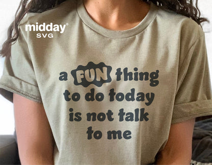 Person wearing a t-shirt with sarcastic text 'a fun thing to do today is not talk to me' in bold letters, designed by midday SVG.