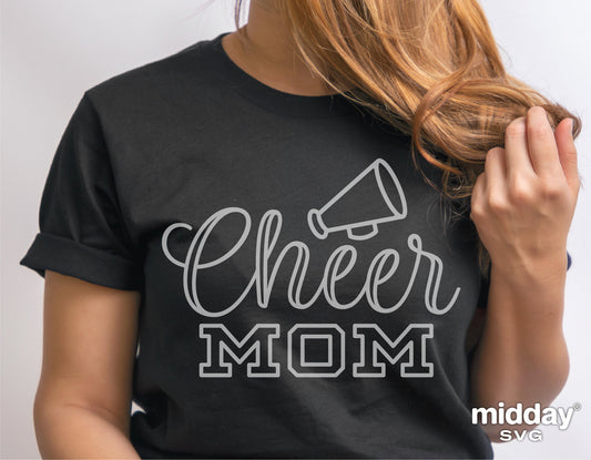 Woman wearing a black T-shirt with 'Cheer Mom' and megaphone design for Cricut cut file projects.