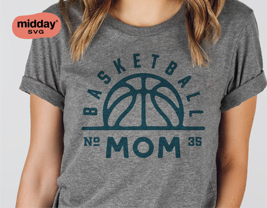 Woman wearing grey t-shirt with 'Basketball Mom' logo, perfect for Cricut and Silhouette cutting crafts.